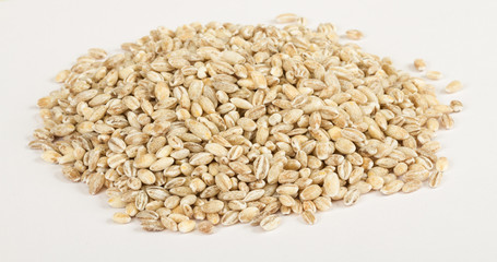 Pearl barley heap isolated on white