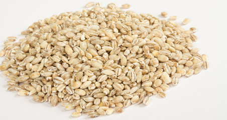 Pearl barley heap isolated on white