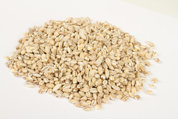 Pearl barley heap isolated on white