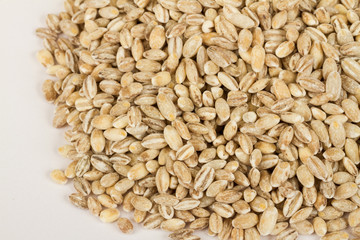 Pearl barley heap isolated on white