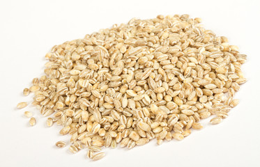 Pearl barley heap isolated on white