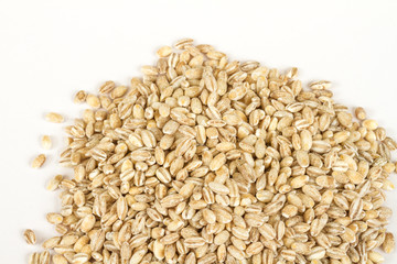 Pearl barley heap isolated on white