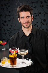 Professional barman cocktail bar hold serving tray