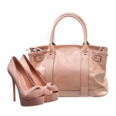 Beautiful platform shoes and handbag over white