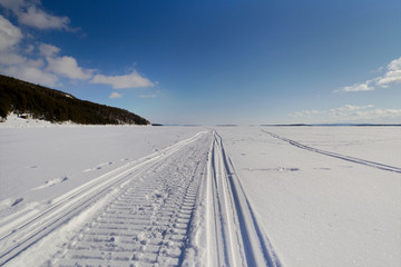 Snowmobile trail stretching into the distance