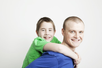 Portrait of beautiful smiling family: father and son