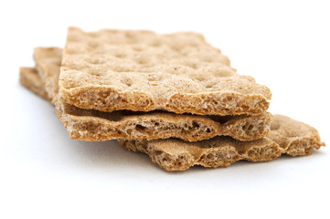 three brown cracker over white background, diet