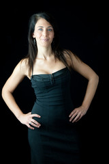 woman smiling at the camera with hands on hips