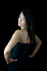 Pretty woman in black blouse looking thoughtfully at the camera