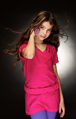 The beautiful, young girl with a flowing hair