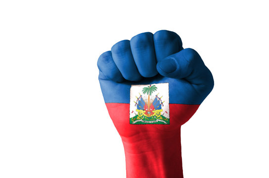 Fist painted in colors of haiti flag