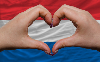 over national flag of netherlands showed heart and love gesture