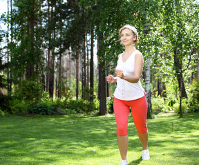 Young girl in a white shirt and red pants