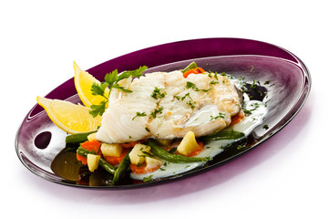 Fish dish - fish fillet in sauce and vegetables