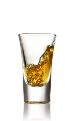 Pouring pepper vodka into glass isolated on white