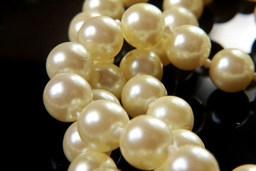 pearl jewelry on a black background