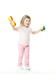 Cute little baby girl doing sport exercises with toy dumbbells