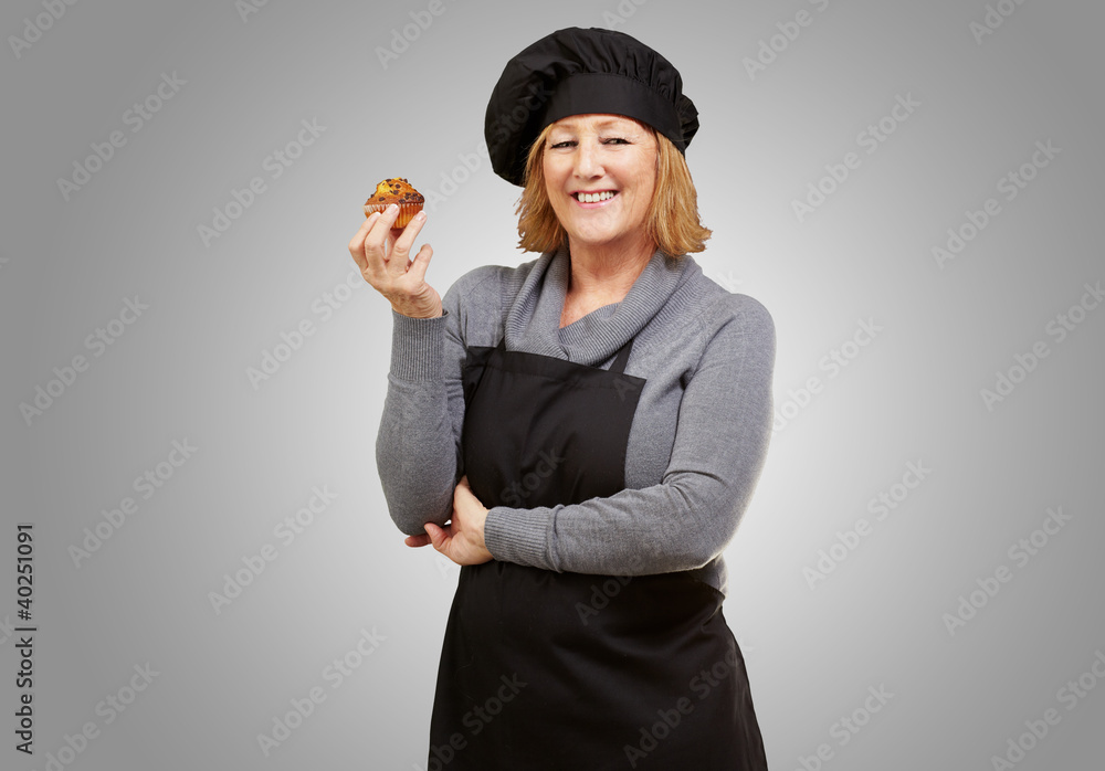 Canvas Prints portrait of middle aged cook woman holding a delicious homemade