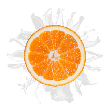 sliced orange splash with milk isolated on white background