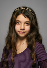 The beautiful, young girl with flowing hair and a diadem