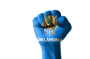Fist painted in colors of us state of oklahoma flag