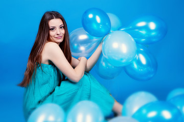 Fototapeta premium Girl with balloons in studio