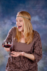 Blond woman with glass of red wine