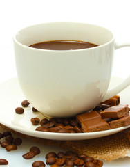 cup of coffee and beans, cinnamon sticks and chocolate isolated