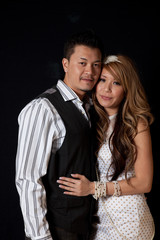 Far Eastern couple laughing together in fun