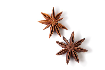 Two anise stars on white, copyspace