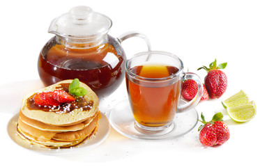 Tea cup with pancakes and berries