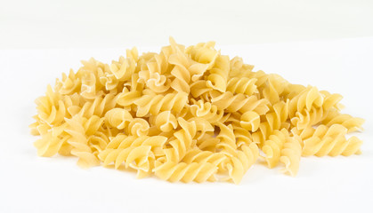 A portion of Rotini corkscrew pasta isolated on white.