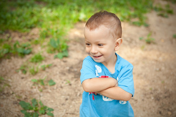 a little boy in blue T-shirt