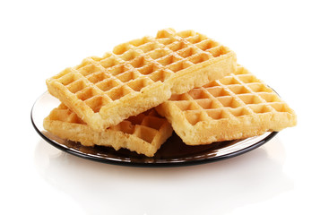 Sweet waffles on plate isolated on white