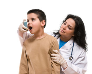 Doctor applying oxygen treatment on a little boy with asthma.