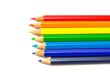 different color pencils close-up on white