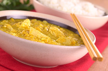 Chicken-mango curry with rice in the back