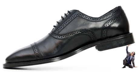 Woman domination concept with shoes and man