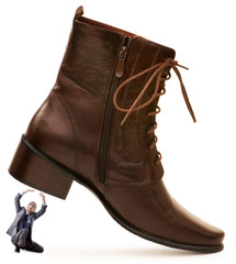 Woman domination concept with shoes and man