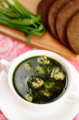 Soup with spinach and meatballs