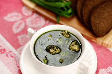 Soup with spinach and meatballs