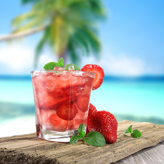 Fresh fruit cocktail on a beach