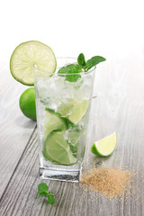 Mojito drink on wooden background