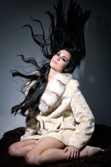 sophisticated and beautiful Latin model with fur coat