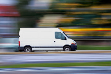 Blur white van  panning and move - Powered by Adobe