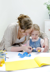 Carving. Mother and daughter doing handicrafts.