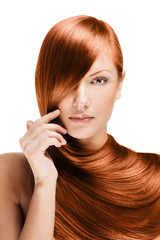 fashion portrait of a woman with beautiful long red shiny hair
