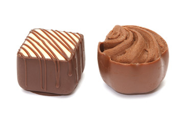 Chocolate pralines on white background