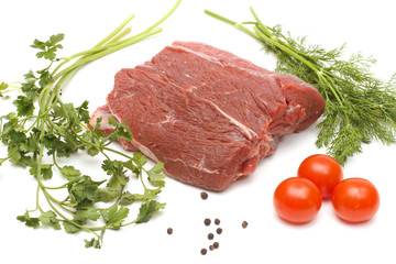 Piece of beef and vegetables on white