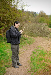 woman birdwatching with notepad